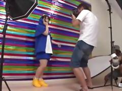 Cute Japanese teen in  penguin suit sucks photographers cock
